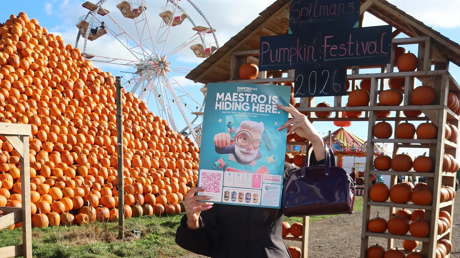 Find Maestro poster in front of pumpkins at Spilmans Pumpkin Festival 2026